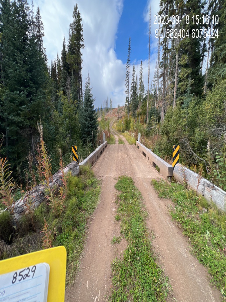 Example of road photo with either the `PSCIS Crossing ID` or the `Modelled ID` on the site card visible in the corner.